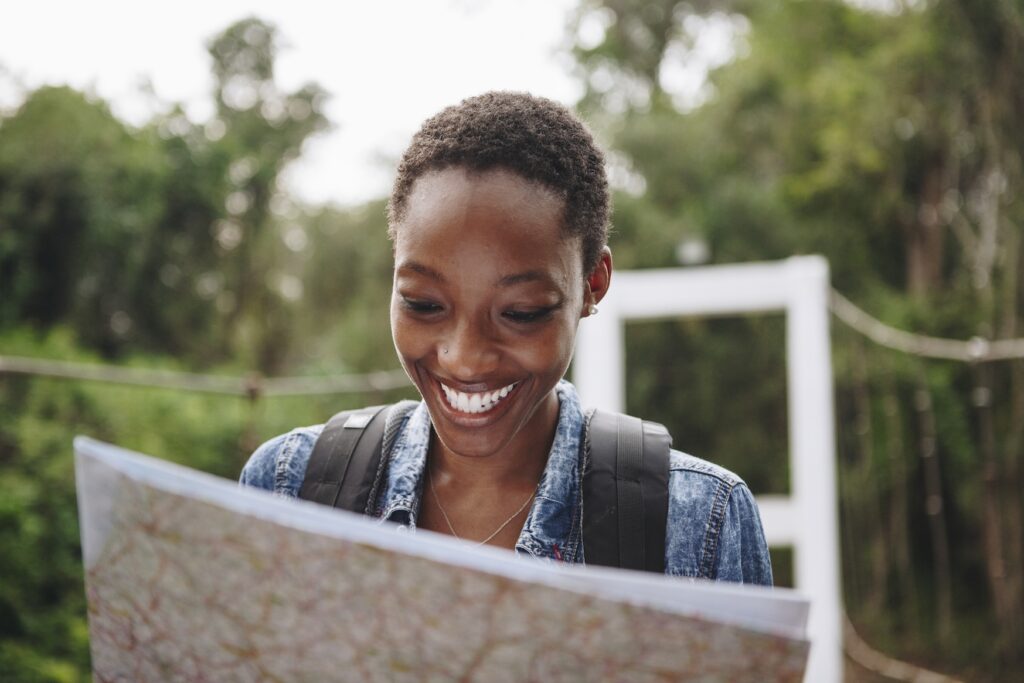 african american woman looking at a map